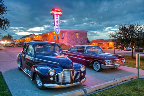 Copyright 2008-2013 The above picture was taken at the Sudbury Count Motel which fronts Historic             U. S. Route 6 in Marengo, Iowa. The 1940 Chevy belongs to Les and Ruthie Foss       of Montesano, Washington and the 1961 Ford belongs to Kris and Heidi Hernandez  of Davenport, Iowa. Should you have any questions about the picture contact   David Darby; Email: dwdarby@aol.com