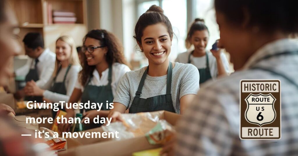 Volunteers smiling while packing donation boxes with the text “GivingTuesday Is More Than a Day — It’s a Movement.”