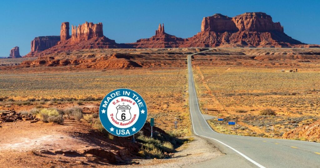 Historic US Route 6 winding through Utah red rock desert under a wide open sky