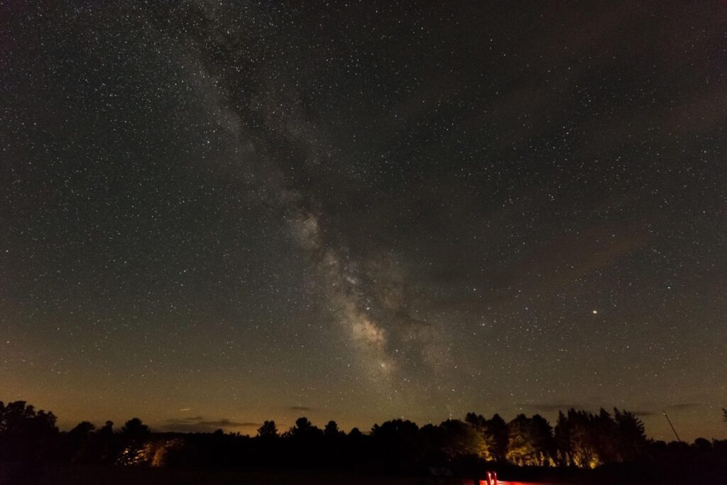 a nighttime view of the Milky Way galaxy from the Night Sky Public Viewing Area at Cherry Springs State Park in Pennsylvania.